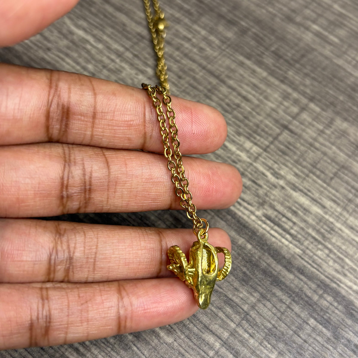 Ram brass pendant
