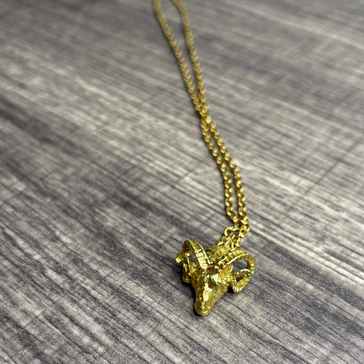 Ram brass pendant