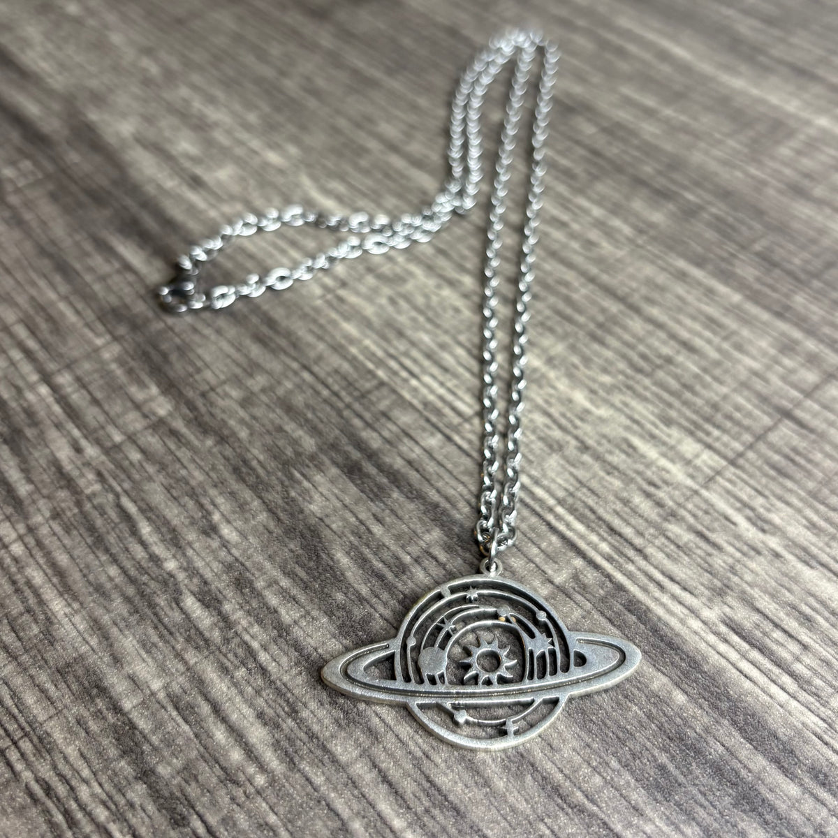 Saturn silver necklace