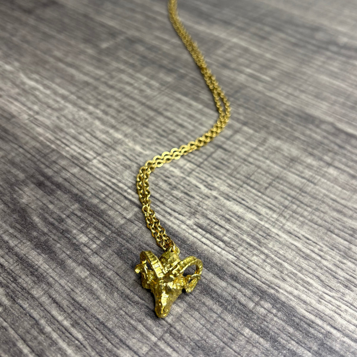 Ram brass pendant