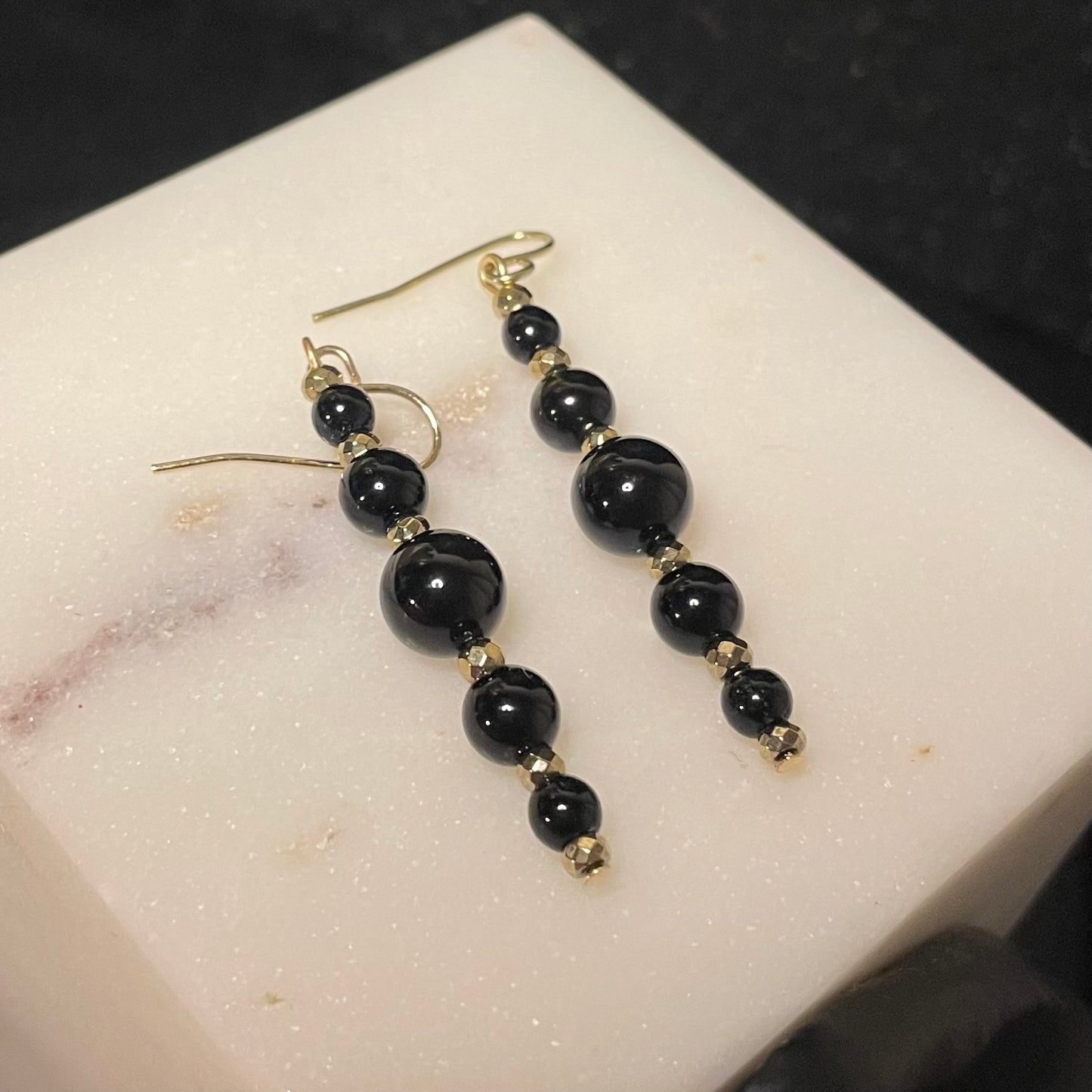 Black onyx and gold (pyrite hematite) accents dangles