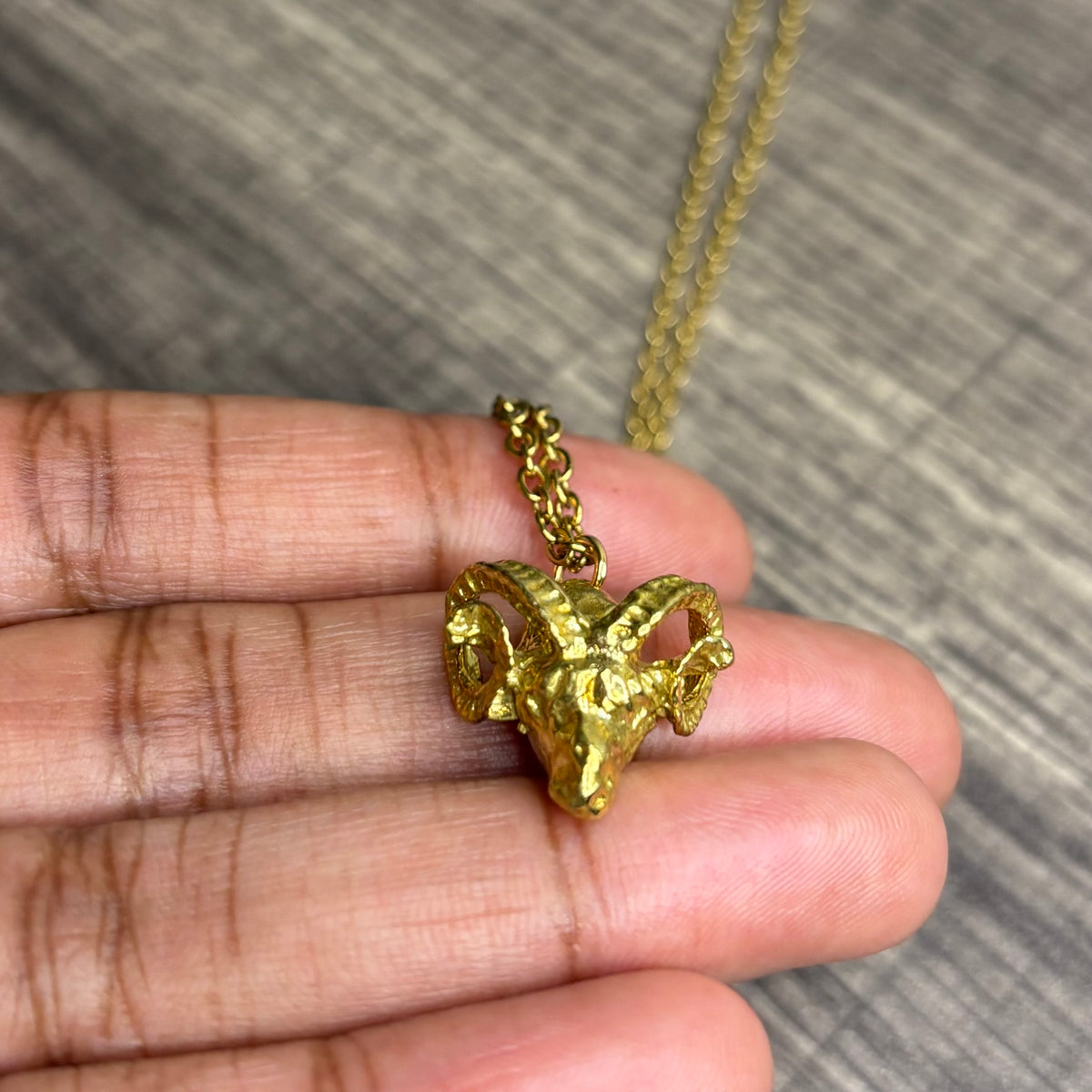 Ram brass pendant