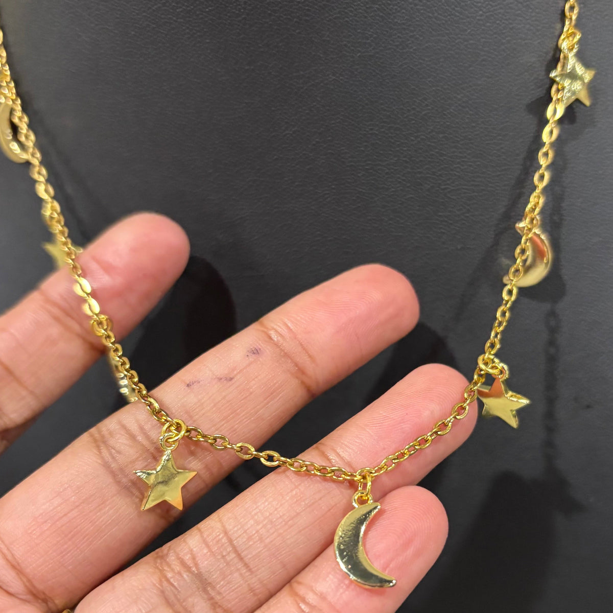 Gold stars and moons necklace